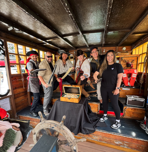 The Lost Treasure crew gathered aboard the pirate ship
